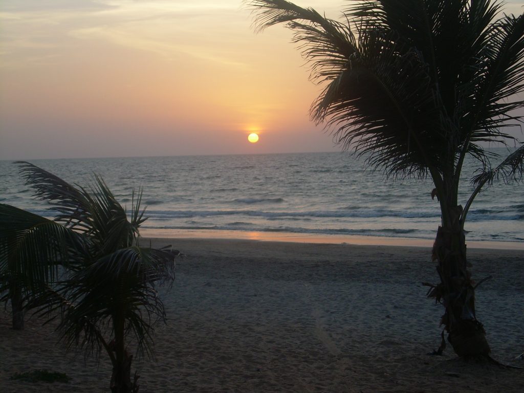 sun sets on Fajara Beach, The Gambia