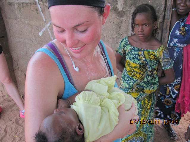 A Canadian nurse and a newborn in The Gambia, Africa