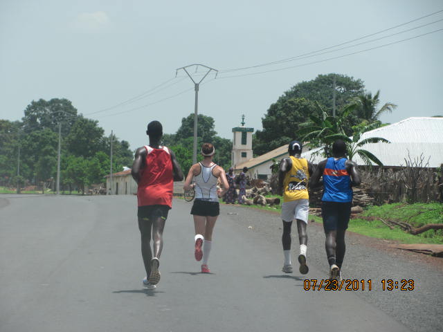 4 teammates run together across The Gambia, Africa