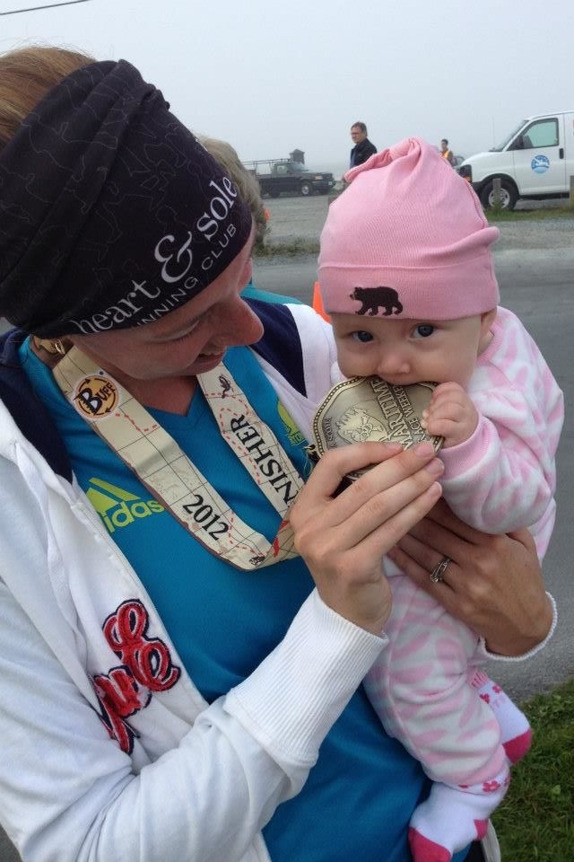 Mom with baby at finish line of race