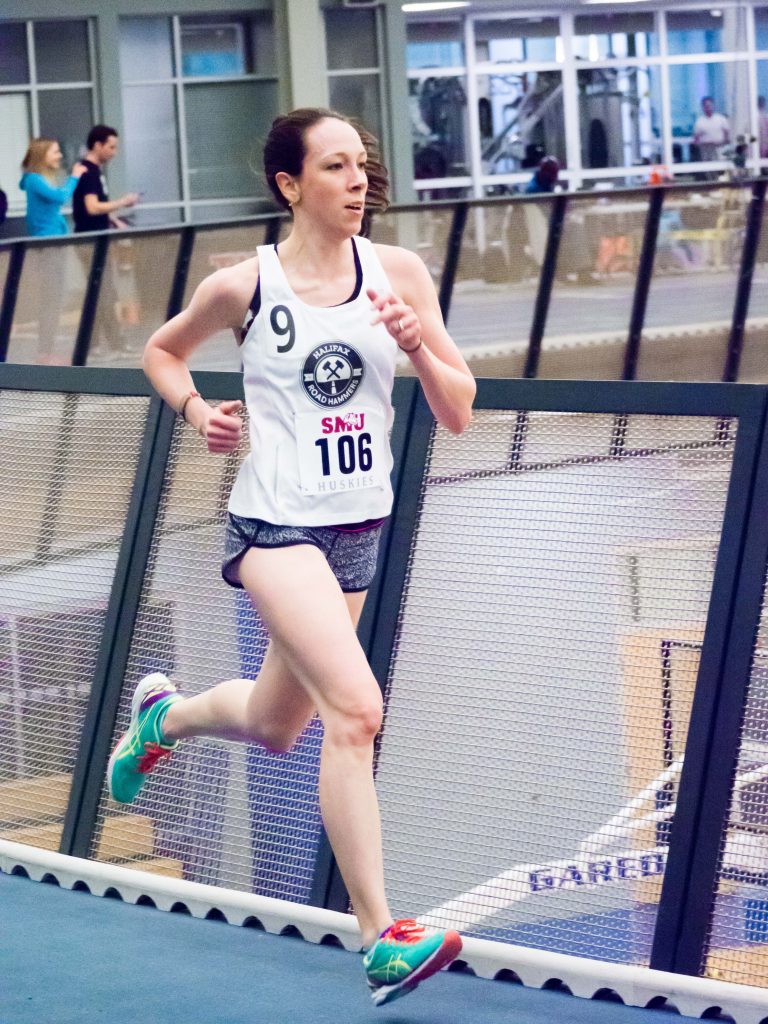 Erin Poirier races 3000m at SMU Indoor Open